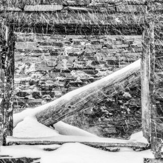 A slate quarry ruin under winter snowfall Snowdonia